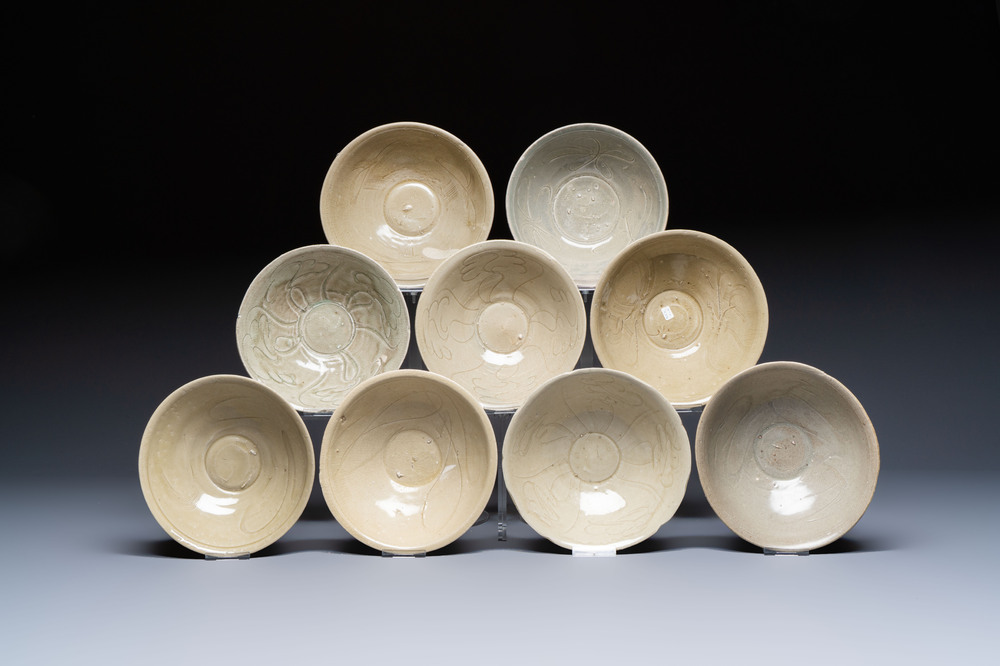 A group of nine Chinese celadon-glazed bowls with incised floral design from the Jepara shipwreck, Fujian kilns, Song