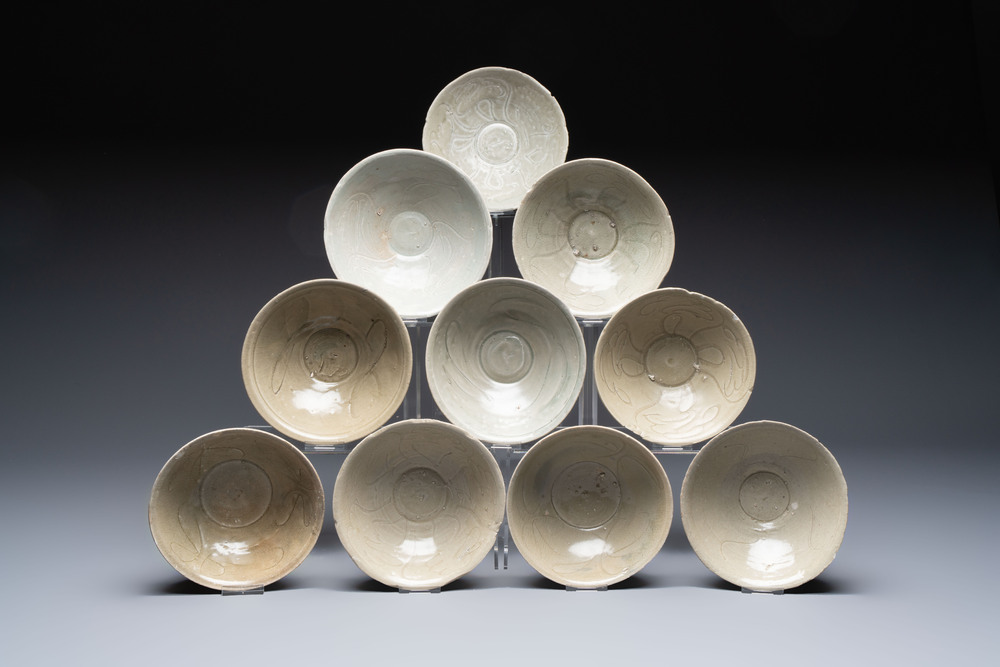 A group of ten Chinese celadon-glazed bowls with incised floral design from the Jepara shipwreck, Fujian kilns, Song
