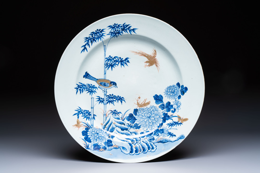 A large Chinese blue and white gilt-decorated dish with birds and insects among bamboo and peonies, Yongzheng