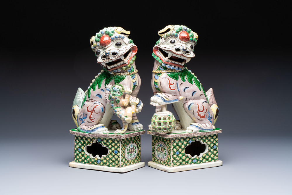 A pair of Chinese verte biscuit models of Buddhist lions, 18th C.