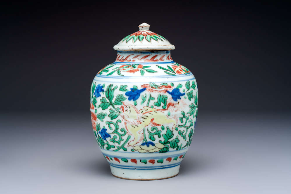 A Chinese wucai &lsquo;Buddhist Lion&rsquo; vase and cover, Transitional period