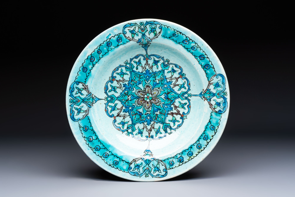 A polychrome Kuthaya pottery Iznik-style turquoise-ground dish, 19th C.