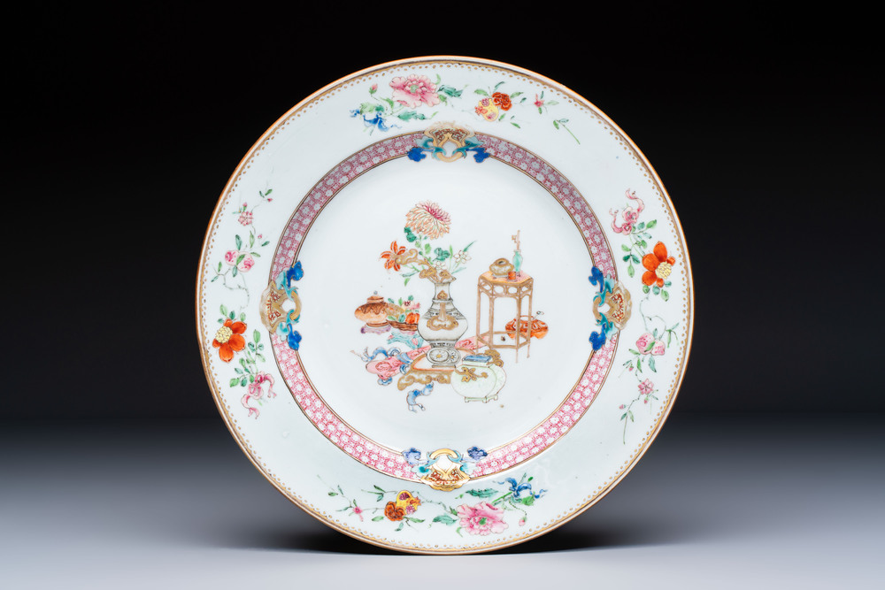 A Chinese famille rose gilt-decorated 'Antiquities' plate, Yongzheng