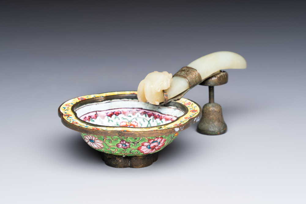 A Chinese celadon jade belt hook mounted as a handle on a Canton enamel bowl, Qing