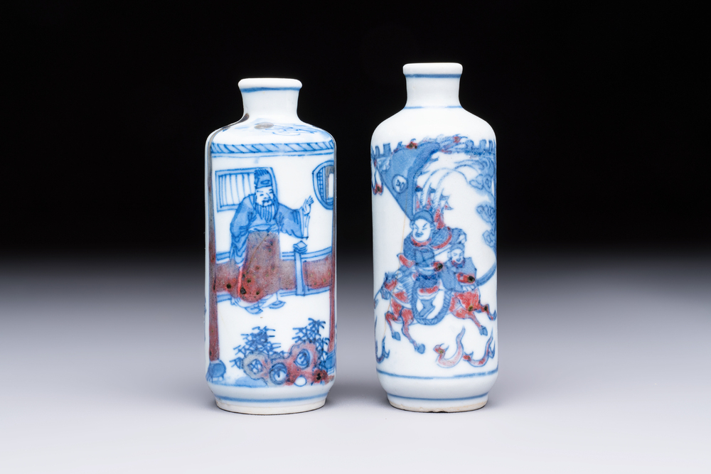 Two Chinese blue, white and copper-red snuff bottles with narrative design, 19th C.