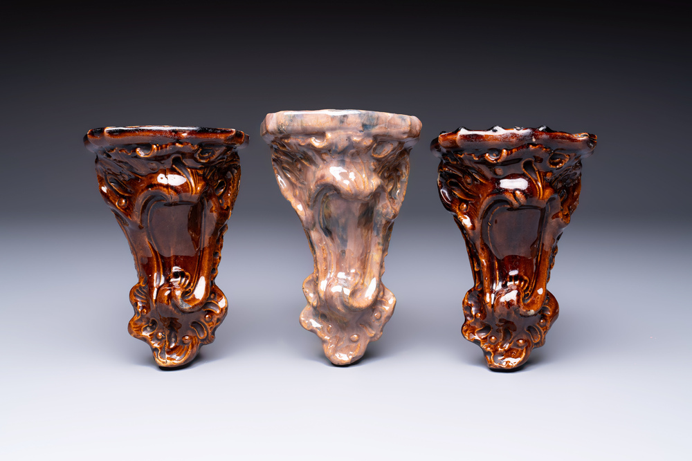 Three rare Bruges faience 'Faux Marble' and brown-glazed wall consoles, Pulinckx workshop, 18th C.