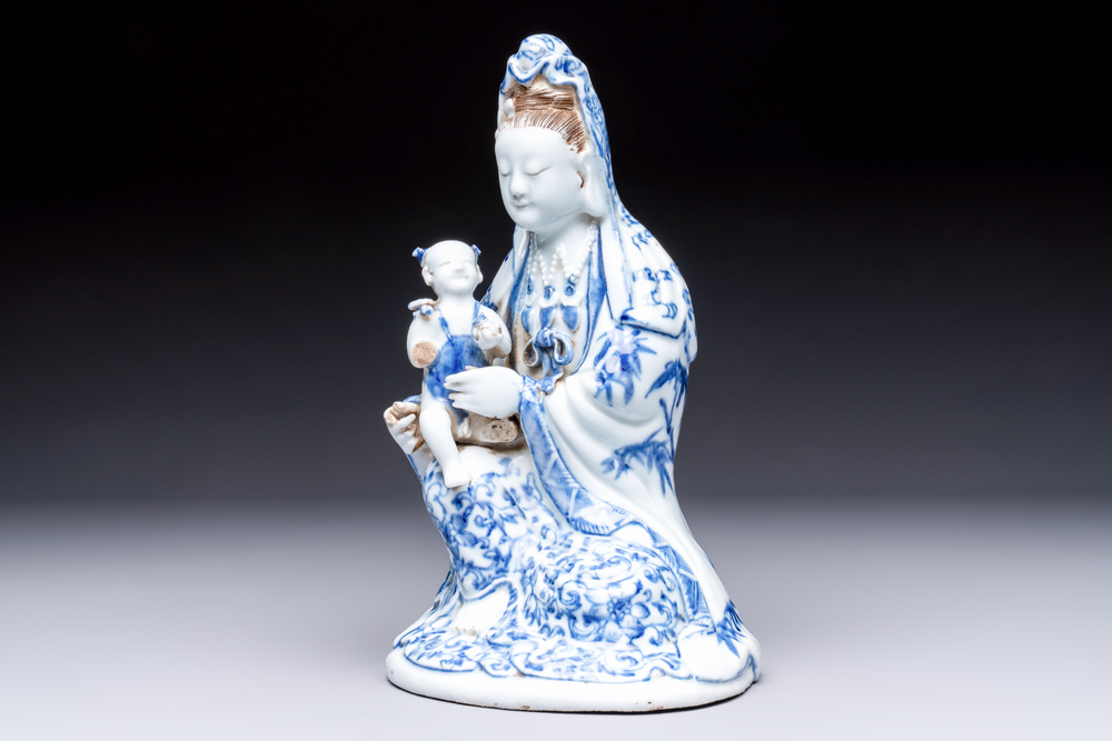 A Chinese blue and white 'Guanyin and child' group, Qianlong
