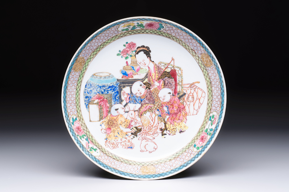 A fine Chinese famille rose eggshell plate with a lady and playing boys, Yongzheng