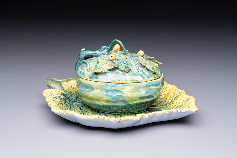 A polychrome Dutch Delft melon-shaped tureen and cover on leaf-shaped stand, 18th C.