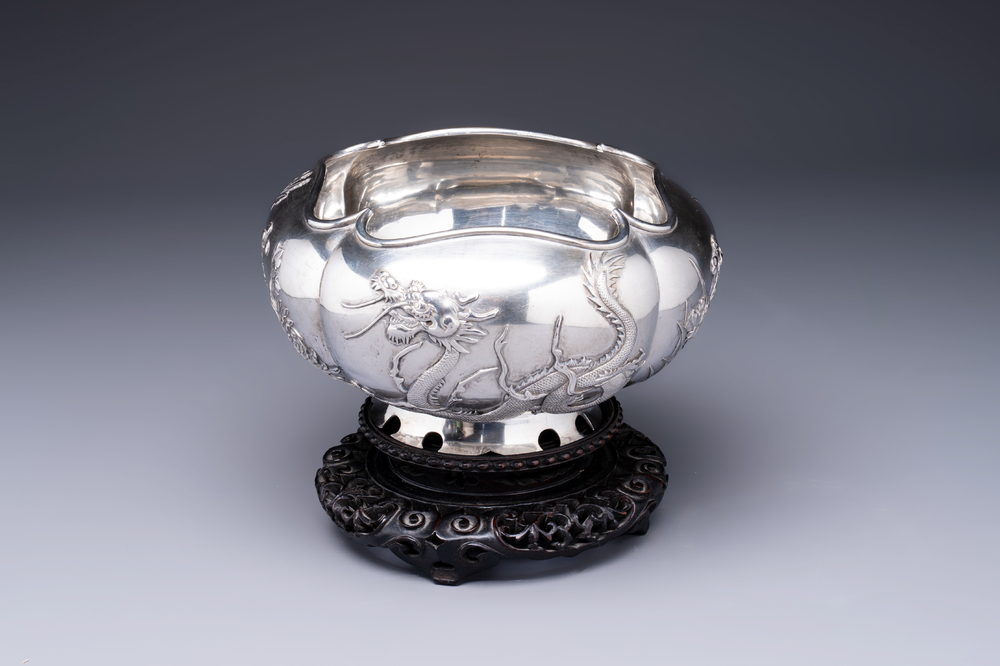 A fine Chinese silver bowl with relief dragon design on reticulated wooden stand, Tai Chang Long 泰昌隆 mark, 19th C.