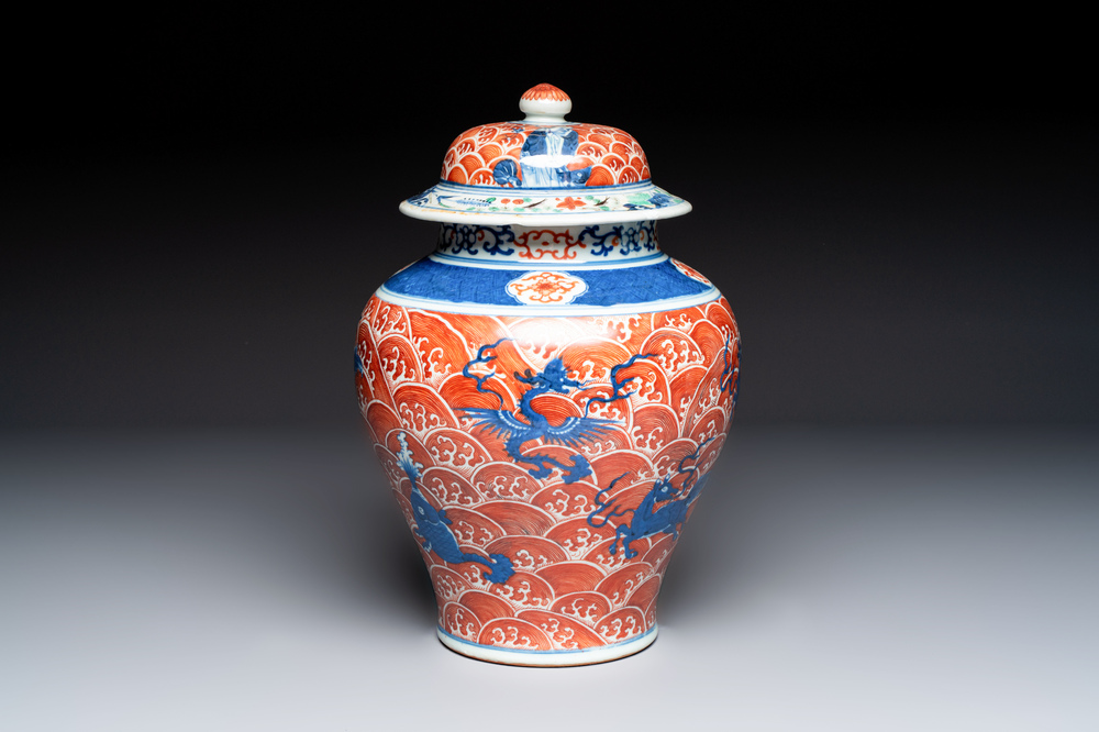 A Chinese blue, white and iron-red decorated 'Mythical Animals' vase and cover, 19th C.
