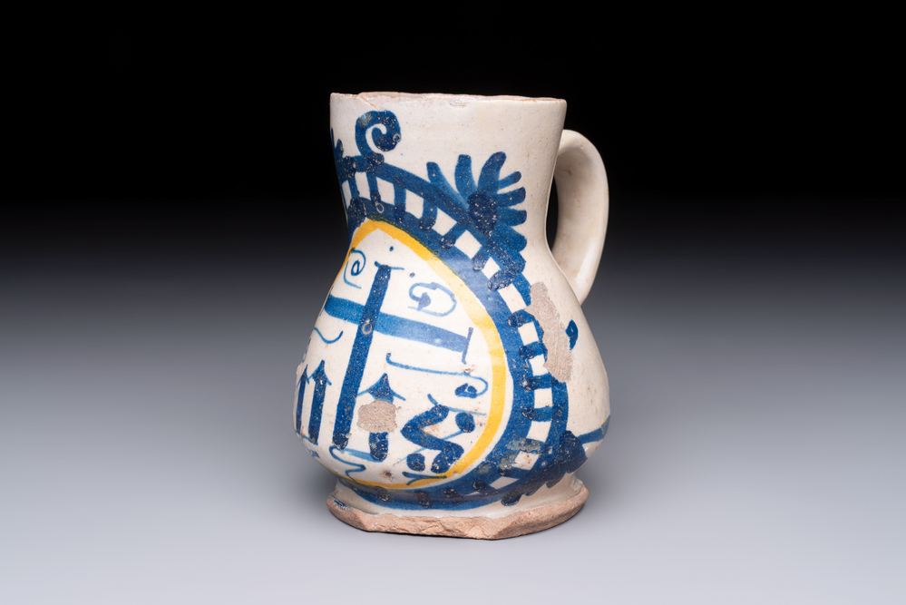 A very rare polychrome Antwerp maiolica 'IHS' jug, 16th C.