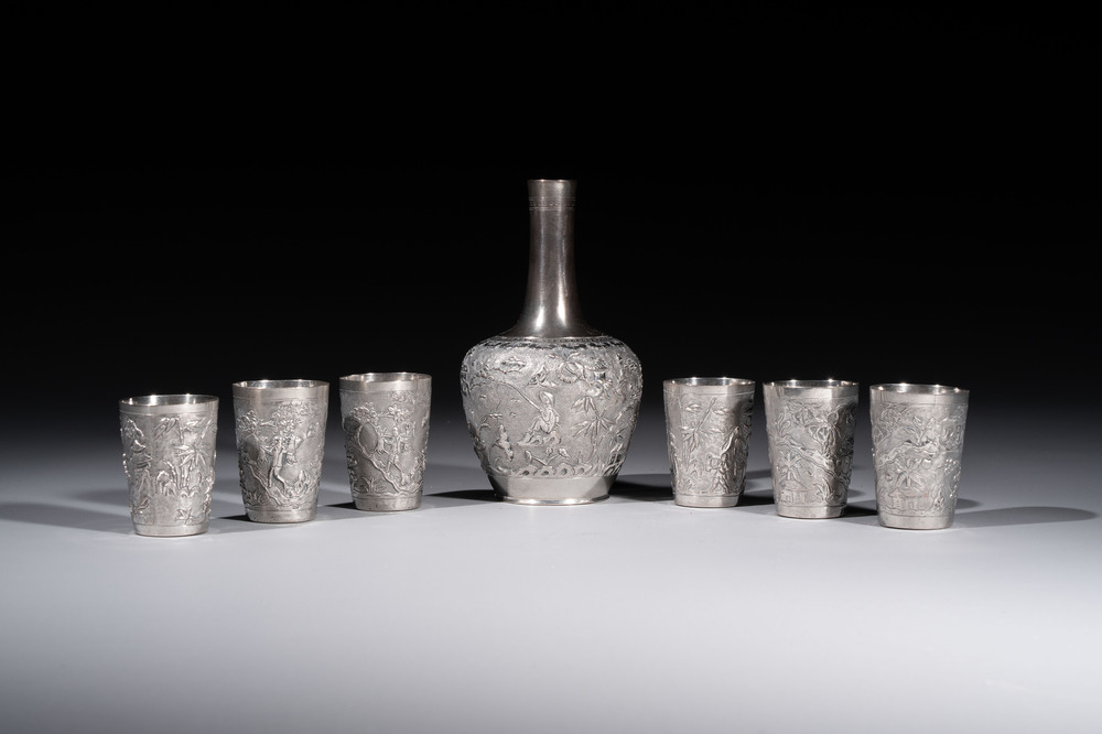 A Chinese Canton or Vietnamese silver bottle vase with landscape design and six cups, 19th C.
