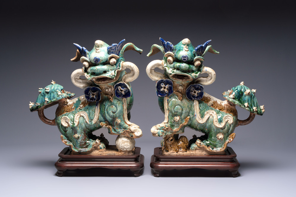 A pair of large Chinese polychrome-glazed Shiwan stoneware Buddhist lions, 19th C.