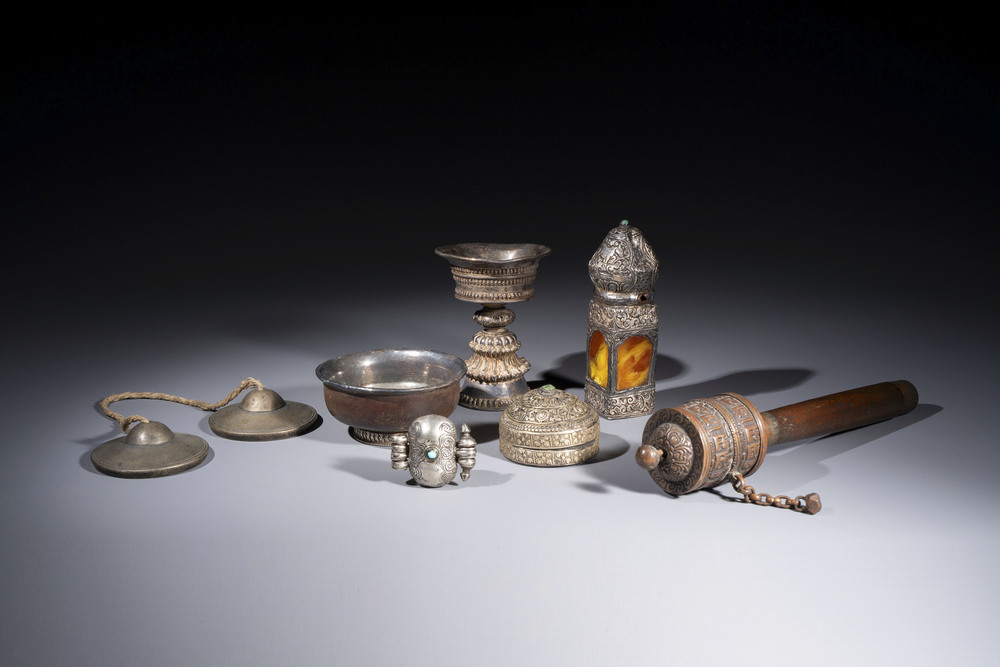 A varied collection of seven Tibetan ritual utensils, including a turquoise-inlaid silver relic holder, 19/20th C.