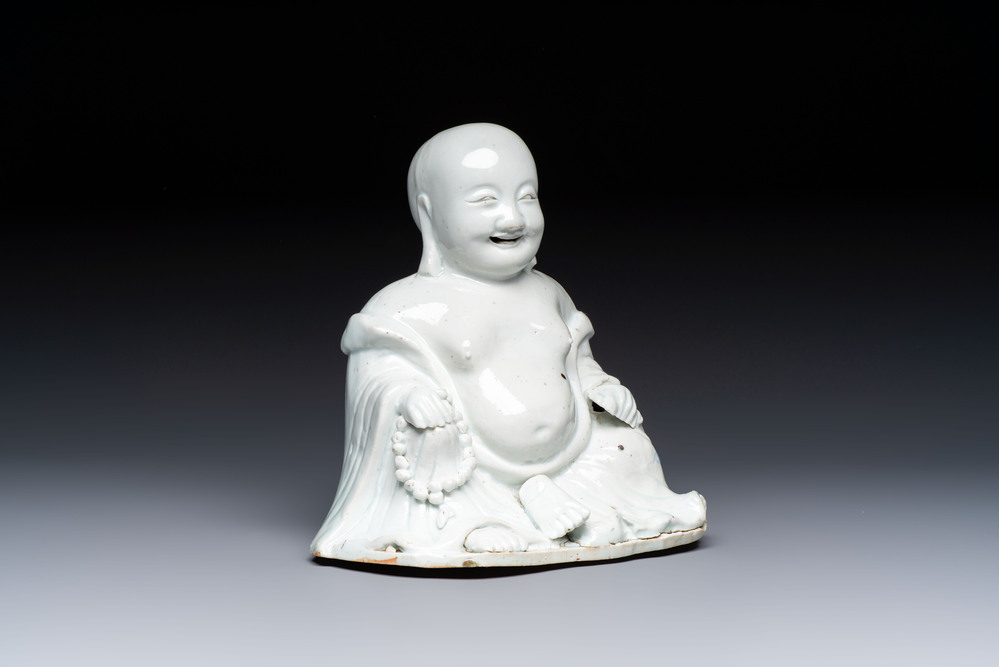 A Chinese white-glazed Milefo Buddha, 19th C.