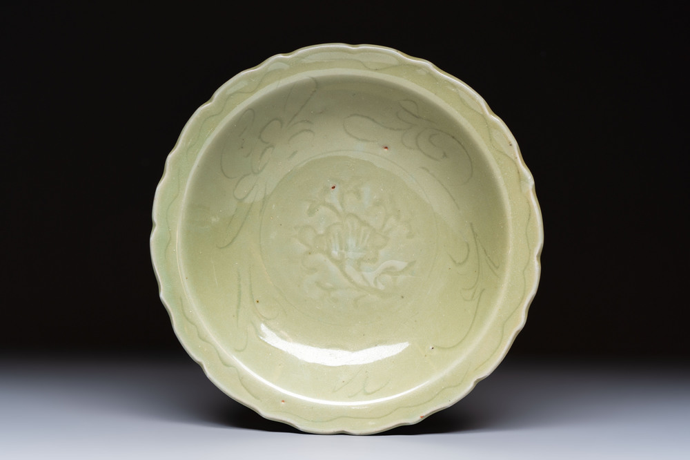 A Chinese Longquan celadon plate with incised floral design, Ming