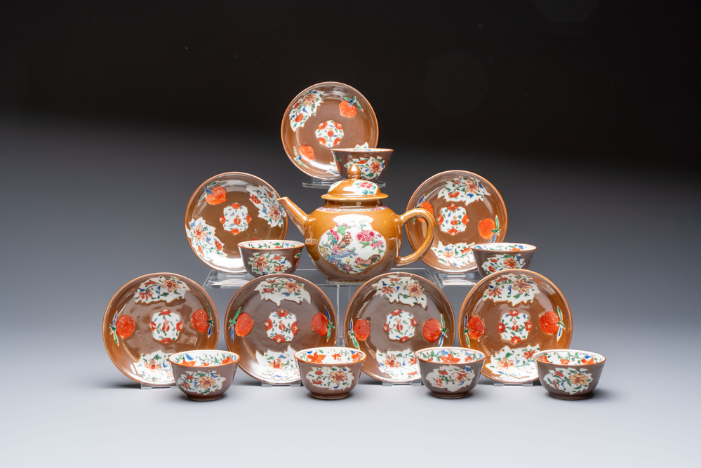 A Chinese famille rose capucine-ground covered teapot with floral design, seven cups and saucers, Yongzheng/Qianlong