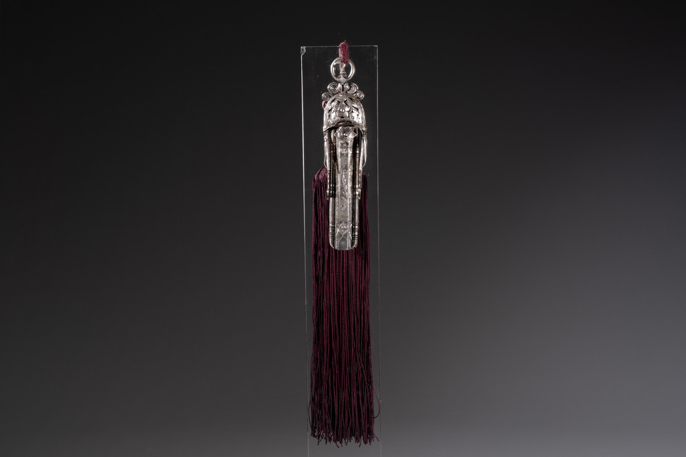 A fine Chinese silver pendant with inscriptions on a plexiglas stand, 19th C.