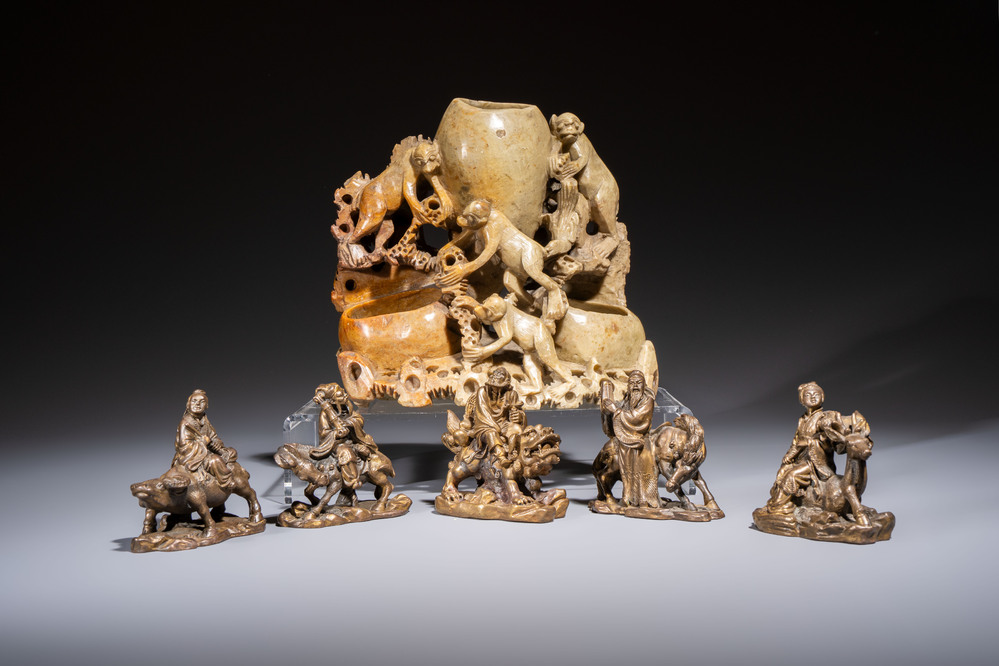Five Chinese bronze 'Immortal' groups and a carved soapstone 'Monkeys' sculpture, 20th C.