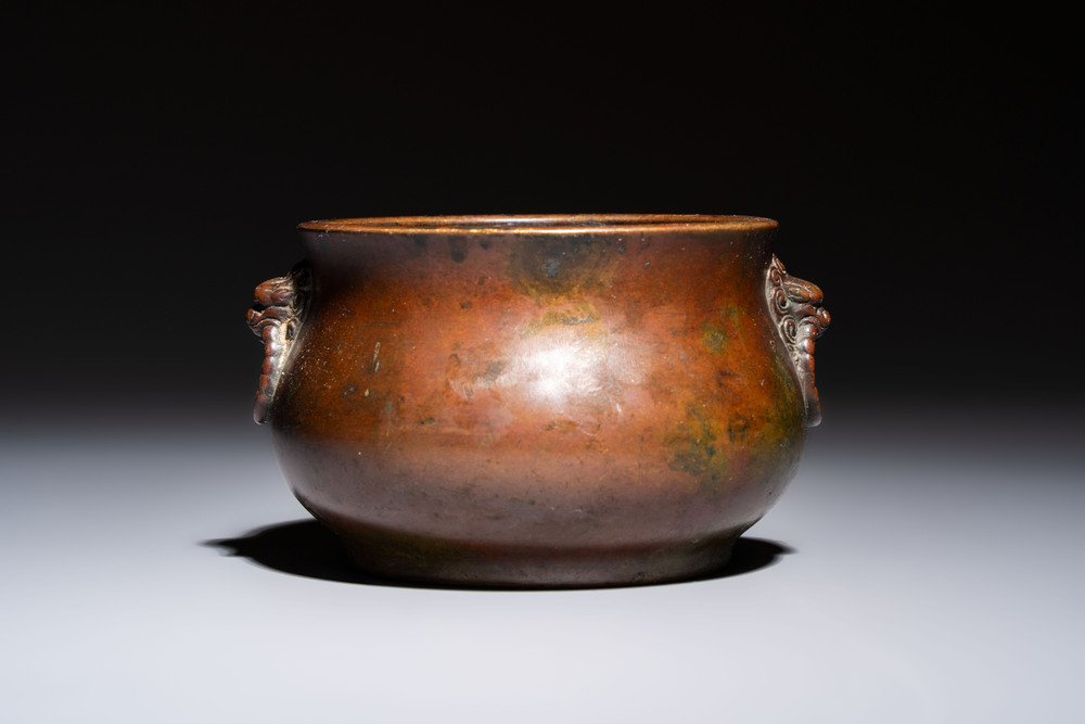A Chinese bronze censer with lion-head handles and relief dragon design, Lu Gu Zhai 侶古齋 mark, 18/19th C.
