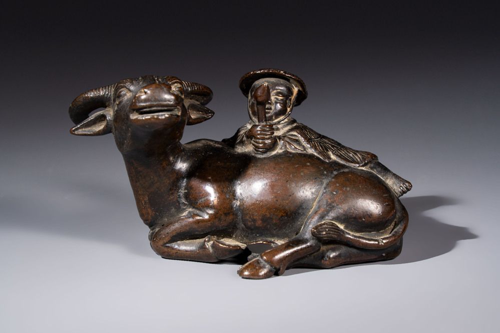 A Chinese bronze 'Boy and Buffalo' paperweight, Ming
