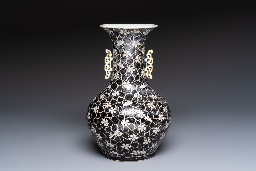 A rare Chinese famille noire 'Prunus on Cracked Ice' vase with 'Chilong' handles, 19th C.