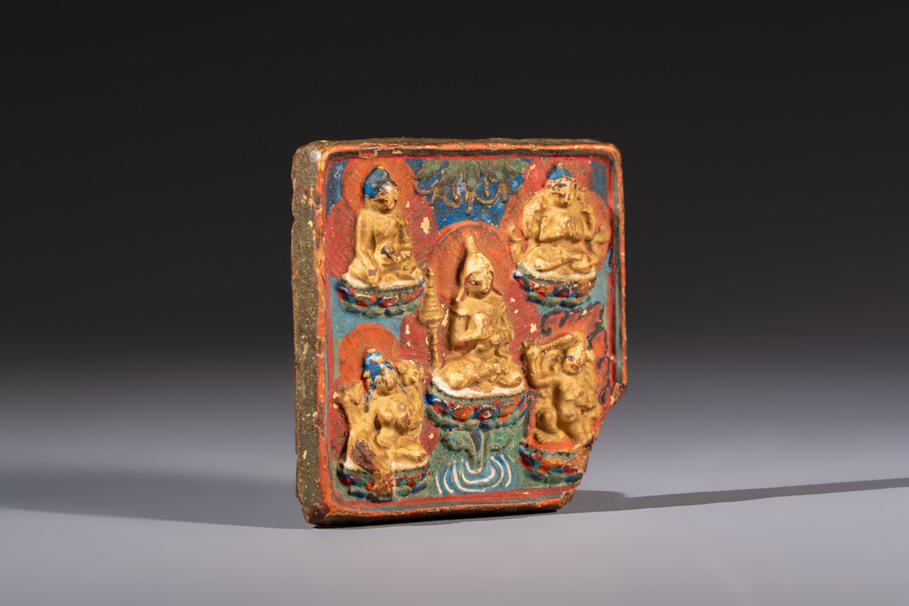 A gilt polychrome stucco votive plaque, Tsha Tsha, Tibet, 18/19th C.