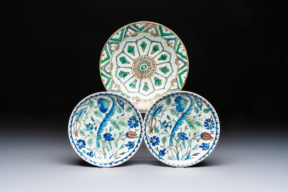 A polychrome Iznik pottery plate and two Kutahya plates, Turkey, 16/19th C.