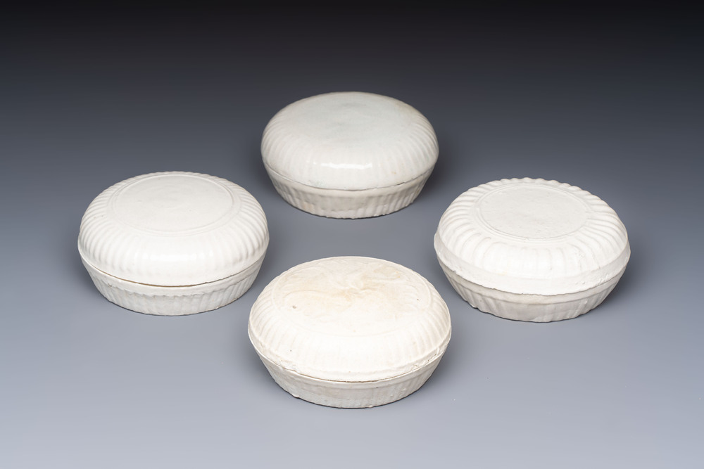 Four Chinese white-glazed boxes and covers with incised floral design from the Jepara shipwreck, Dehua or Anxi kiln, Song