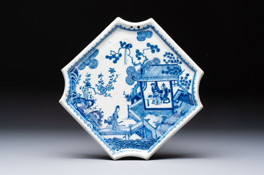 A blue and white Dutch Delft 'Chinoiserie' plaque with figures in garden, 18th C.