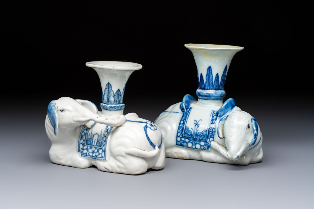 Two Chinese blue and white recumbent elephant-form candlesticks, Jiaqing