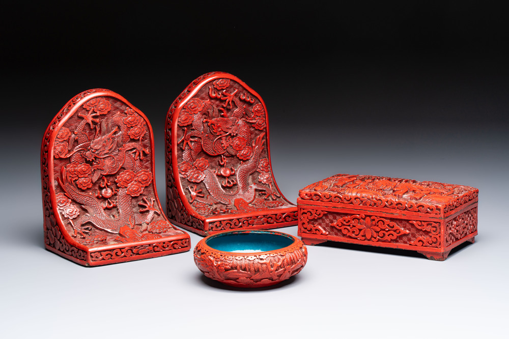 A pair of Chinese cinnabar lacquer bookends, a covered box and a brush washer, 19/20th C.