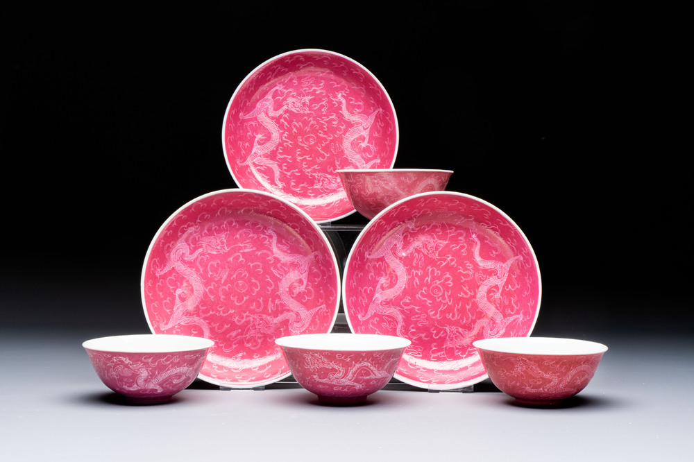 Four Chinese sgraffito ruby-ground 'Dragon' cups and three plates, Qianlong mark, Republic