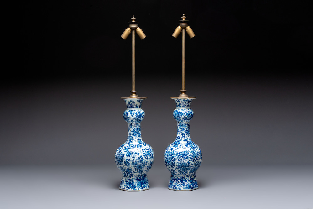 A pair of blue and white Dutch Delft garlic-head vases mounted as lamps, 18th C.
