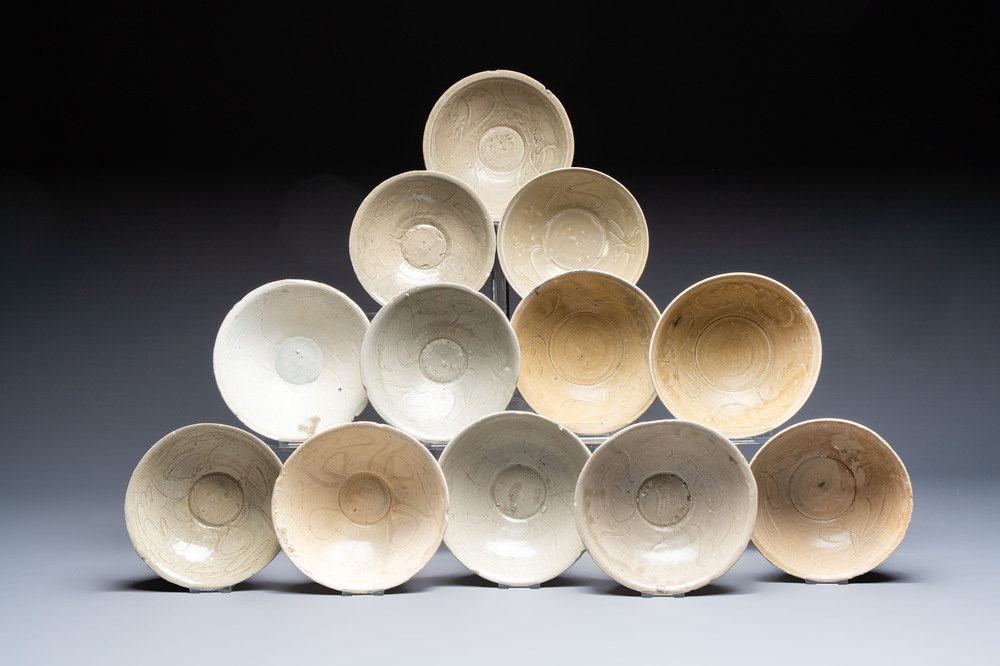 A group of 12 Chinese celadon-glazed bowls with incised floral design from the Jepara shipwreck, Fujian kilns, Song