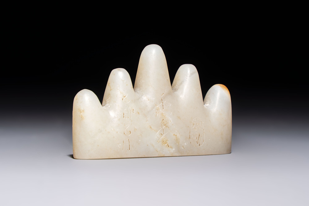 A Chinese white jade mountain-shaped brush rest with narcissus design, Dajie 大玠 mark, dated 1879