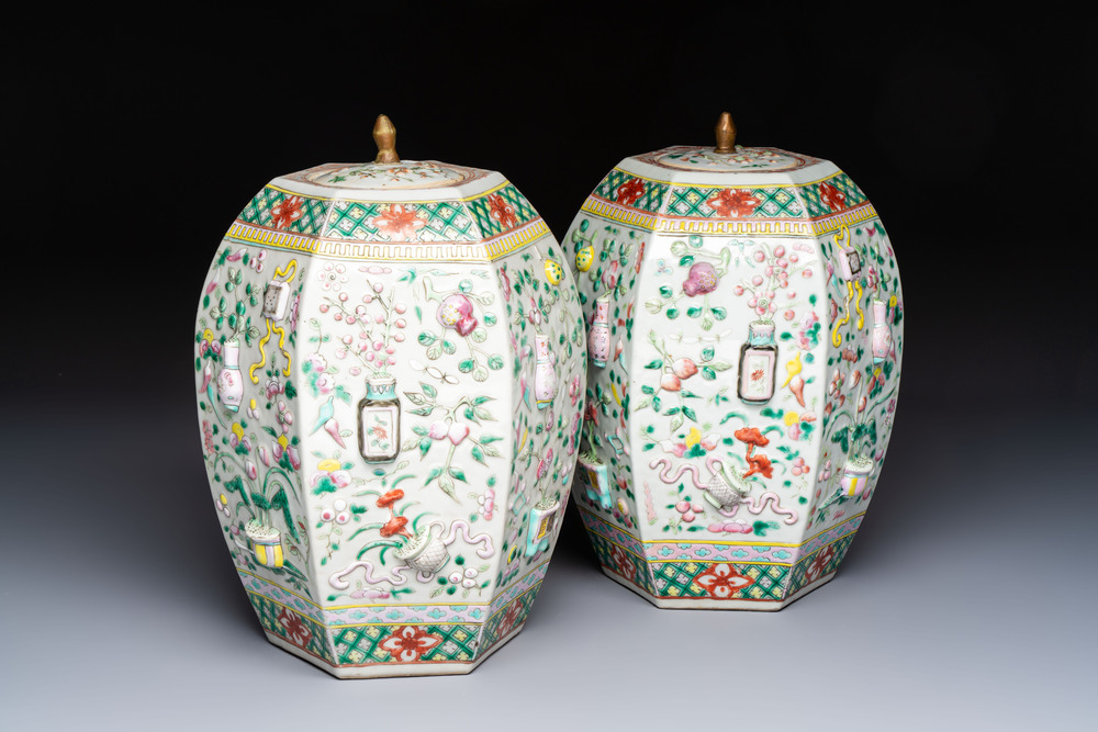 A pair of Chinese famille rose 'Antiquities' vases and covers, 19th C.