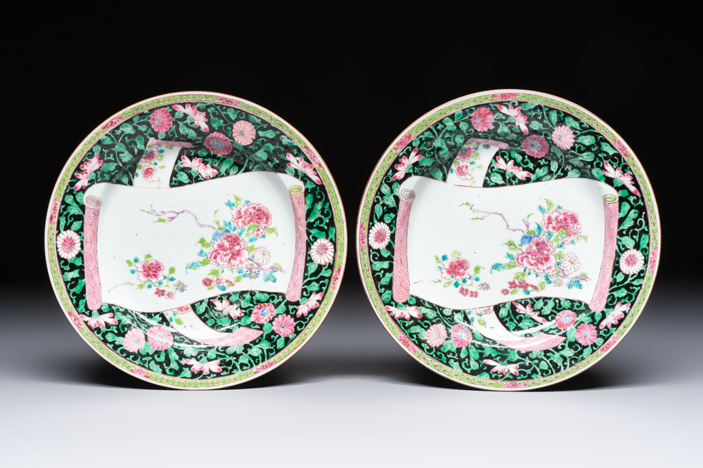 A pair of fine Chinese famille rose black-ground 'Scrolls and Flowers' plates, Yongzheng/Qianlong