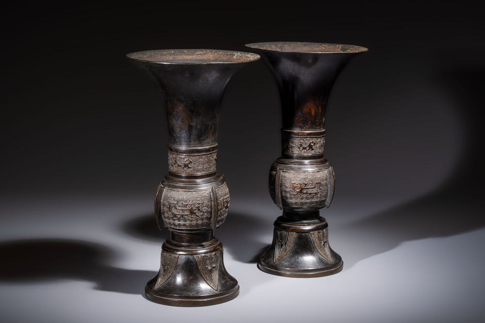 A pair of Chinese archaistic bronze 'Gu' vases, 18th C.