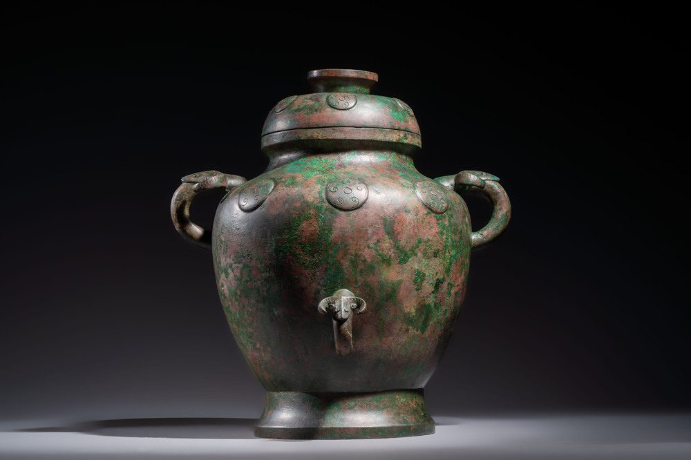 A large Chinese archaistic bronze wine vessel and cover with ram-form handles, Lei 罍, Ming