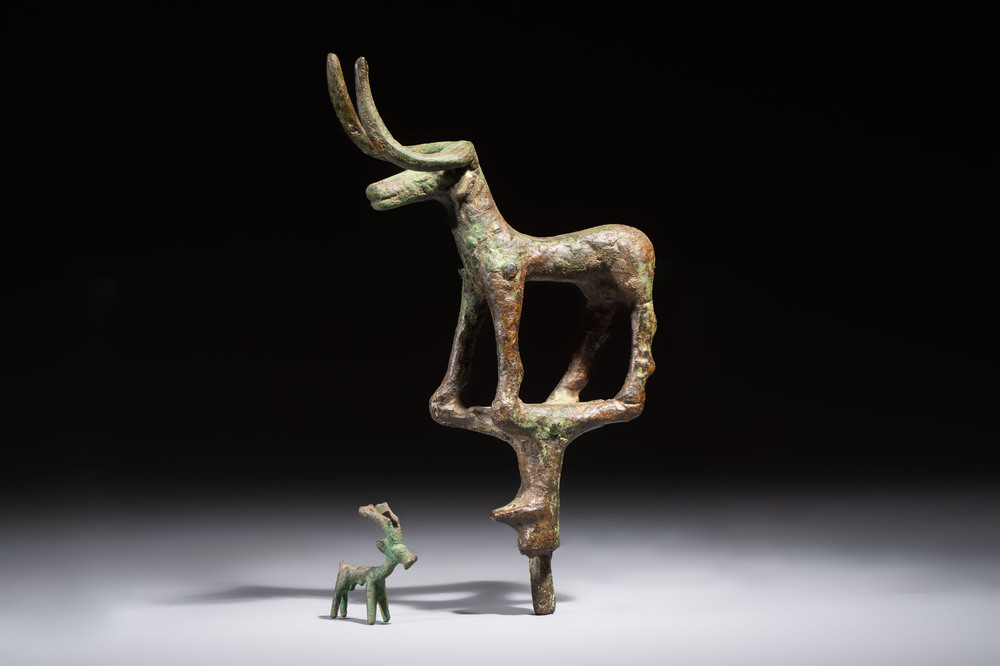 An Anatolian copper-alloy standard surmounted by a long-horned bull and a Luristan deer, 1st millennium BC.