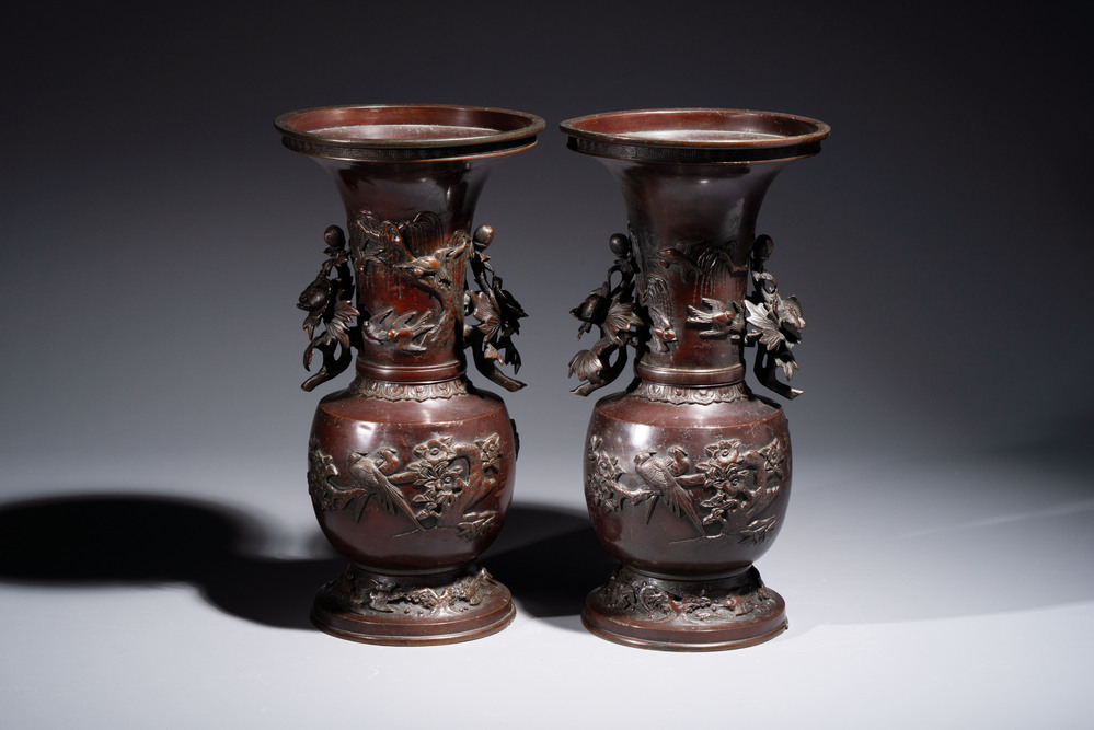 A pair of Japanese bronze vases with relief design of birds among flowering branches, signed Hasegawa Harusada 長谷川晴定, 19th C.
