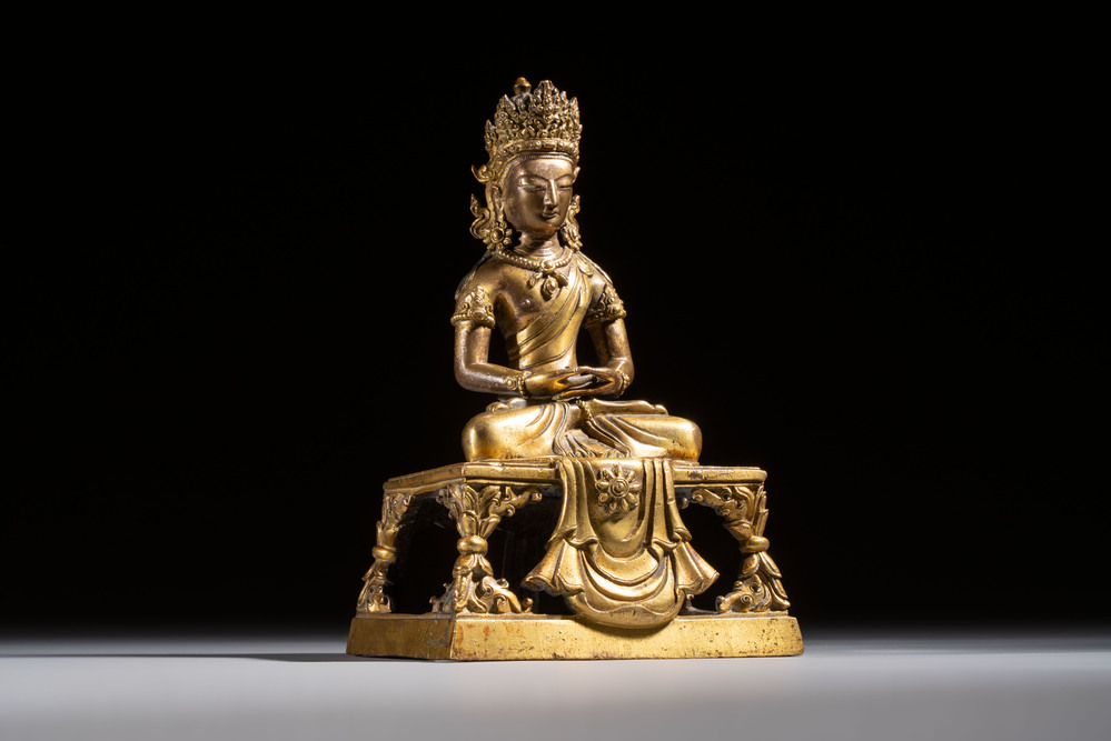 A Sino-Tibetan gilt-bronze figure of Buddha Amitayus, inscribed, Qianlong