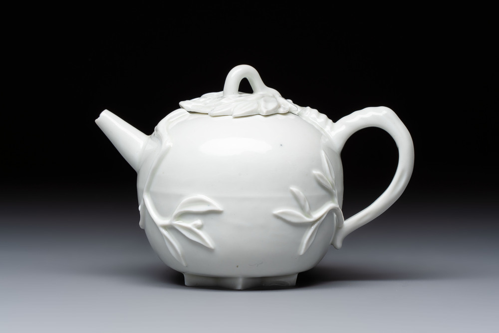 A Chinese Dehua blanc de Chine 'Pomegranate' teapot and cover, Kangxi