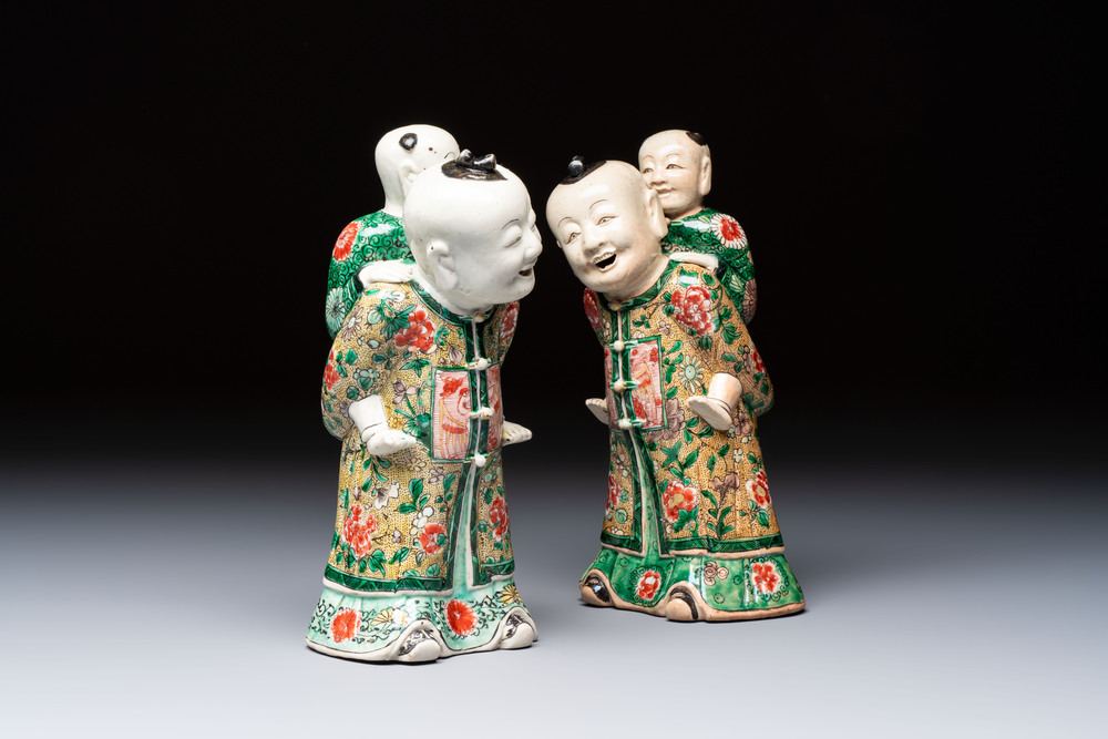 A pair of Chinese verte biscuit 'Piggyback Boys' groups, Kangxi