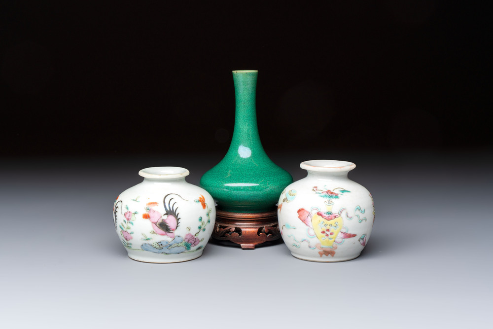 A Chinese green crackle-glazed vase on wooden stand and two famille rose 'Roosters' and 'Antiquities' water pots, 19th C.