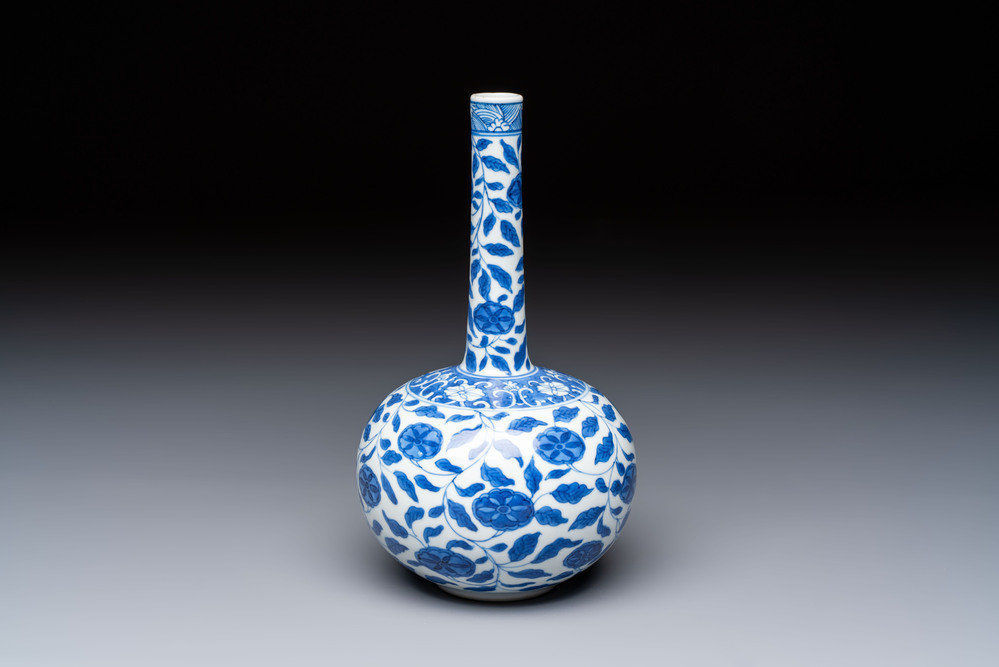 A rare Chinese 'G-marked' blue and white bottle vase with floral design, Kangxi