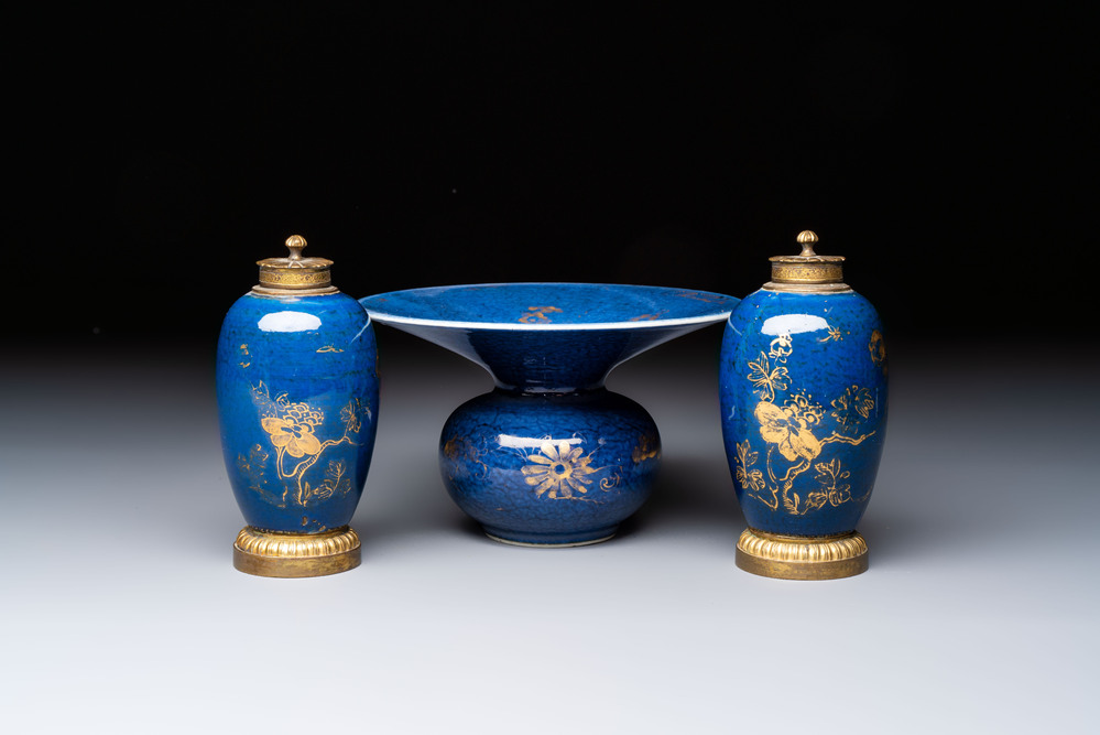 A Chinese powder-blue-ground gilt-decorated spittoon and two gilt-bronze-mounted vases, 18th C.