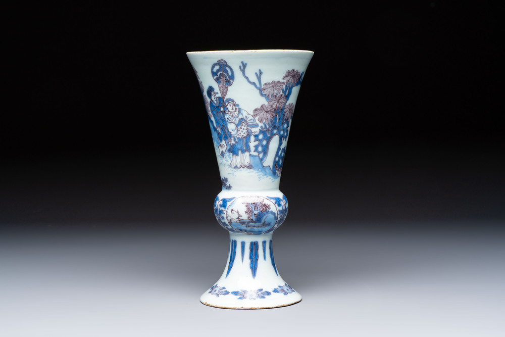 An extremely rare blue, white and manganese Dutch Delft chinoiserie beaker vase after a silver model, late 17th C.